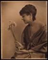 [Woman holding flowers]