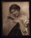 [Woman holding flower]