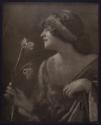 [Woman holding flowers]