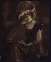 [Woman with hat and fan]