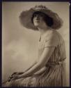 [Woman in hat]