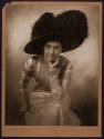 [Woman in big hat]