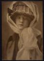 [Woman in hat]
