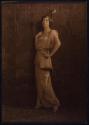 [Standing woman]