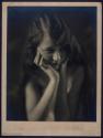 [Woman with long hair]