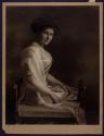 [Seated woman]