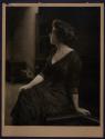 [Seated woman]