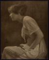 [Seated woman]