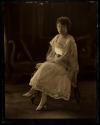[Seated woman]