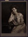 [Seated woman]