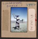 [Person in traditonal clothing and mask, Livingstone, Zambia (travel slide)]