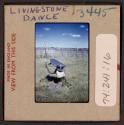[Person in traditional clothing and mask, Livingstone, Zambia (travel slide)]