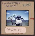 [Person in traditional clothing and mask, Livingstone, Zambia (travel slide)]