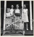 [Four girls on porch]