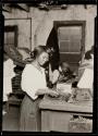 [Woman working in print shop]