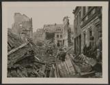 Infantrymen Walk Through Rubble After an Air Bombardment in Bitburg, Germany