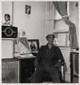 [Puerto Rican man with dog, Buffalo, New York]
