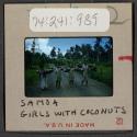 [Girls carrying coconuts, Samoa (travel slide)]