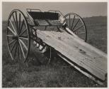 [Old farm vehicle in the field]