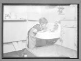 [Child Playing in Sink]