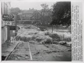 Water Surges Over Bridge