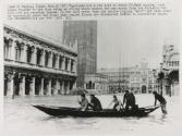 [Venetians use a row boat to cross St. Mark square]