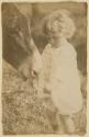 [Young Kate Steichen Feeding Pet Donkey, Voulangis, France]