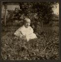 [Portrait of Baby in the Grass with a Rabbit]
