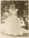 [Joan Martin Running in a  White Dress]