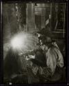 [Welder at work in Empire State building]