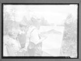 [Two People Painting Outside]