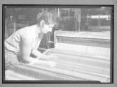 [Woman with Hand in Loom]