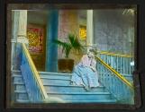 [Woman on porch steps]