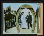 [Early locomotive with couple under horseshoe]