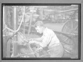 [Man with Loom]