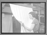 [Woman Holding Cloth]