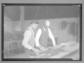 [Two Men Designing Fabric]