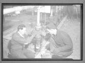 [Men Working on Pipes]