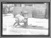Boy Drinking from hydrant, NYC