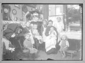 Woman and 7 children in Tenement Kitchen NYC