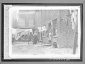 View Into The Backyard Of One Of Chicago's Slums Dilapidated And Dirty...Clothesline....