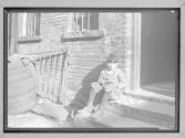 [Boy on Stoop]