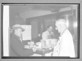 [Two Men in Soup Kitchen]
