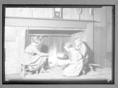 [Girl Scouts cooking in fireplace]