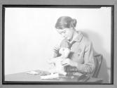 [Girl Scout making a toy]