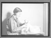[Girl Scout making stuffed toy]