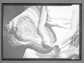 [Woman hooking a rug]