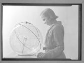 [Girl Scout with globe]