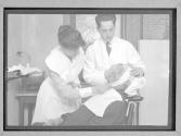 Intern and Nurse treating injured workman