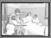 [Woman Reading to Children]
